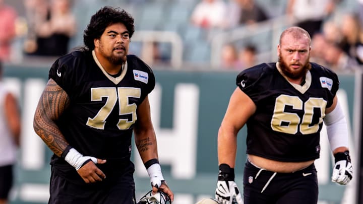 Aug 20, 2024; New Orleans, LA, USA; New Orleans Saints offensive tackle Taliese Fuaga (75) and New Orleans Saints guard Kyle Hergel (60) during practice at Yulman Stadium (Tulane). 