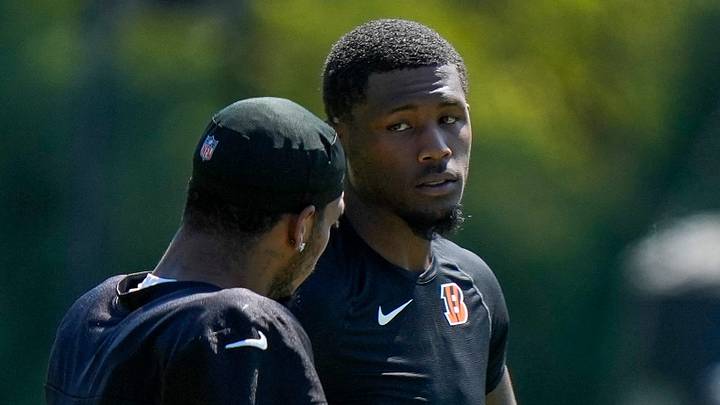 Cincinnati Bengals wide receiver Ja'marr Chase (1) talks on the sideline with wide receiver Tee Higgins (5) after being injured on a play during Bengals training camp practice at the Paycor Stadium practice facility in downtown Cincinnati on Tuesday, Aug. 25, 2026. Cincinnati Bengals wide receiver Ja'marr Chase (1) talks on the sideline with wide receiver Tee Higgins (5) after being injured on a play during Bengals training camp practice at the Paycor Stadium practice facility in downtown Cincinnati on Tuesday, Aug. 25, 2026.