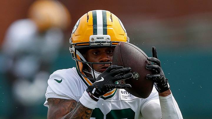 Green Bay Packers running back MarShawn Lloyd (32) catches a pitch during the first day of training camp