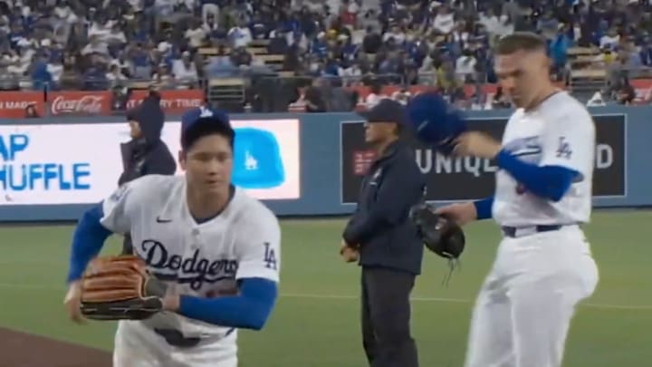 Shohei Ohtani races to get ready to hit during a stellar pitching performance on Tuesday.