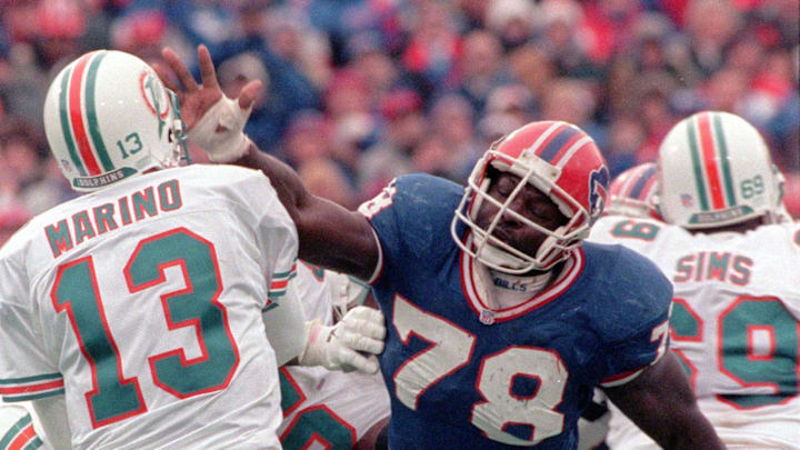 Buffalo Bills’ Bruce Smith pressures Miami Dolphins quarterback Dan Marino during the fourth quarter in 1995.