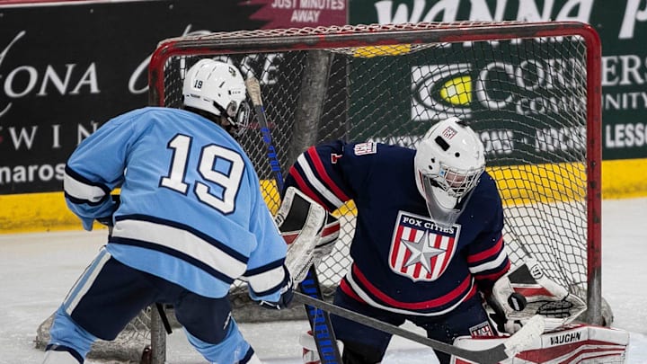 Fox Cities Stars' Elliot Reichenbacher (1) makes a save on a shot by Bay Port High School's Chaz Del Marcelle (19) during a WIAA Division 1 regional semifinal on Monday, February 18, 2025, at Cornerstone Community Center, Wis. Bay Port won the game, 4-1.
Tork Mason/USA TODAY NETWORK-Wisconsin