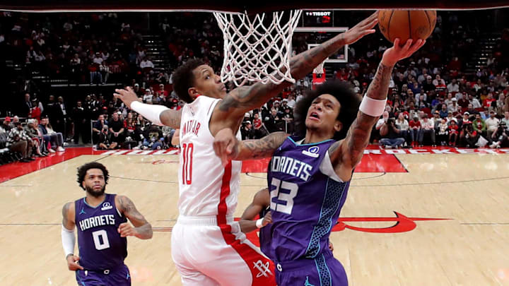 Feb 5, 2026; Houston, Texas, USA; Houston Rockets forward Jabari Smith Jr. (10) blocks a shot by Charlotte Hornets guard Tre Mann (23) during the fourth quarter at Toyota Center. Mandatory Credit: Erik Williams-Imagn Images