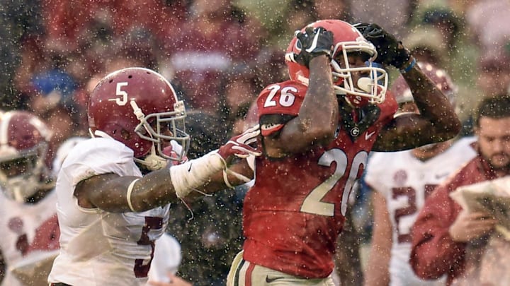 Oct 3, 2015; Athens, GA, USA; Georgia Bulldogs wide receiver Malcolm Mitchell (26) reacts to a missed pass during the third quarter as Alabama Crimson Tide defensive back Cyrus Jones (5) at Sanford Stadium. Mandatory Credit: Dale Zanine-Imagn Images Oct 3, 2015; Athens, GA, USA; Georgia Bulldogs wide receiver Malcolm Mitchell (26) reacts to a missed pass during the third quarter as Alabama Crimson Tide defensive back Cyrus Jones (5) at Sanford Stadium. Mandatory Credit: Dale Zanine-Imagn Images