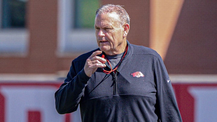 Arkansas Razorbacks coach Sam Pittman watching spring practice drills on the outdoor fields in Fayetteville, Ark.