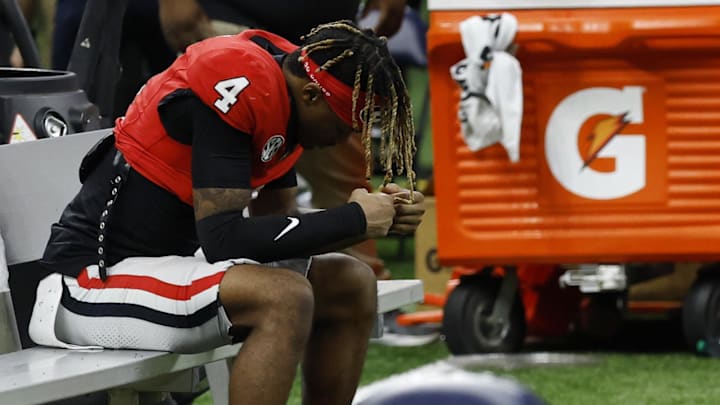 Jan 2, 2025; New Orleans, LA, USA; Georgia Bulldogs defensive back KJ Bolden (4) reacts on the bench after the Bulldogs' game against the Notre Dame Fighting Irish at Caesars Superdome. Mandatory Credit: Geoff Burke-Imagn Images Jan 2, 2025; New Orleans, LA, USA; Georgia Bulldogs defensive back KJ Bolden (4) reacts on the bench after the Bulldogs' game against the Notre Dame Fighting Irish at Caesars Superdome. Mandatory Credit: Geoff Burke-Imagn Images