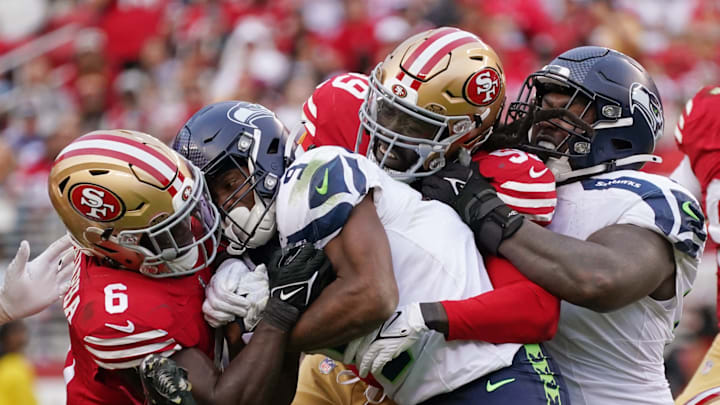 Nov 17, 2024; Santa Clara, California, USA; San Francisco 49ers safety Malik Mustapha (6) and San Francisco 49ers defensive tackle Maliek Collins (99) tackle Seattle Seahawks running back Kenneth Walker III (9) with Seattle Seahawks offensive tackle Charles Cross (67) in on the play during the fourth quarter at Levi's Stadium.