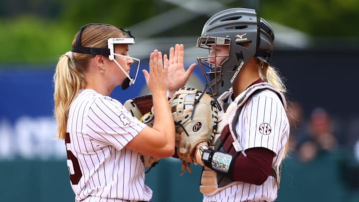 Mississippi State pitcher Raelin Chaffin and catcher Ella Wesolowski high five before an inning in Wednesday's second round SEC Tournament game against LSU.