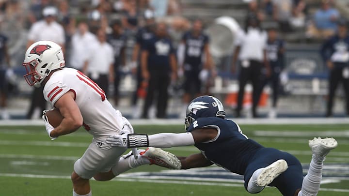 Nevada's Isaiah Essissima tries to tackle Incarnate Word's Taylor Grimes at Mackay Stadium in Reno