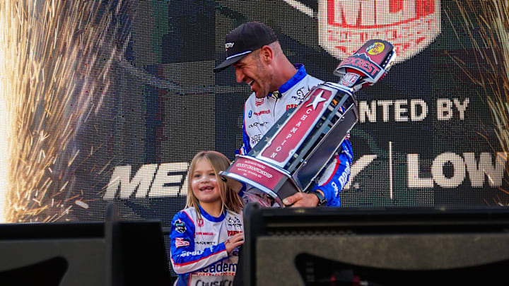 Jacob Wheeler and seven-year-old daughter Olivia celebrate his first REDCREST title on Table Rock Lake. On Saturday, Olivia had given her father the best advice of the tournament: "Dad, you don't have to win today. Just win tomorrow."