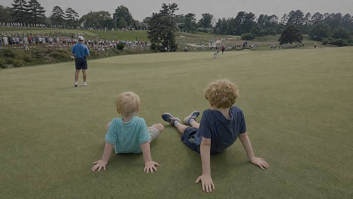 Theodore (left) and George (right) watching the U.S. Amateur on the 5th hole at Merion. 
