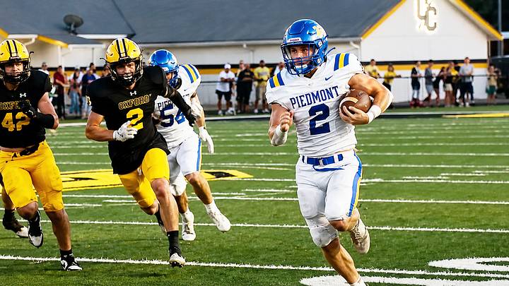 Piedmont's Jaxson Howard outruns the Cherokee Co, defense for the first of his three touchdowns in the Bulldogs 26-6 win, Piedmont's Jaxson Howard outruns the Cherokee Co, defense for the first of his three touchdowns in the Bulldogs 26-6 win,