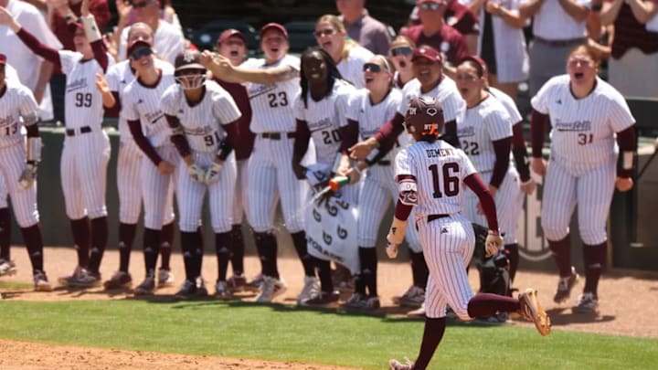 Texas A&M softball's KK Dement rounds third and heads for home plate after hitting a home run against LSU.