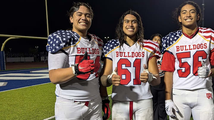 Sione Felila, left, shares a moment with Oak Hills HS teammates Nathan Cabrejo and Inoke Finau.