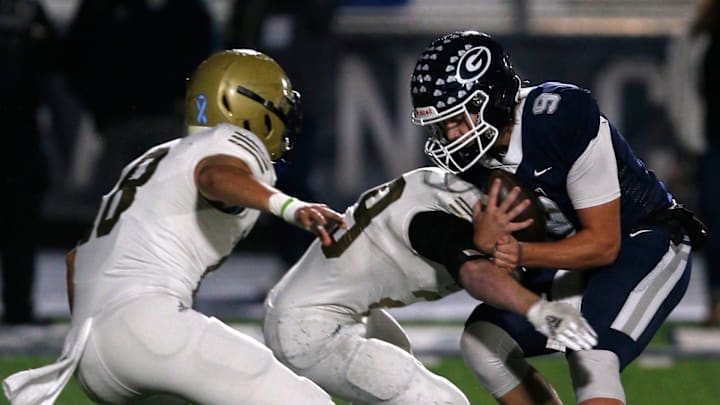 Greenwood's Hunter Houston (9) holds onto the ball as Pulaski Academy defenders close in for the tackle during the 6A West Conference game on Oct. 28 at Smith Robinson Stadium.

Greenwood Pul Acad Fb 102822 17