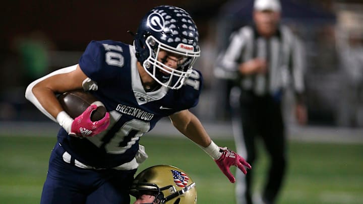 Greenwood's Peyton Presson (10) tries to escape from Pulaski Academy's Jett Smith (20) during the 5A West Conference game on Oct. 28 at Smith Robinson Stadium.

Greenwood Pul Acad Fb 102822 09