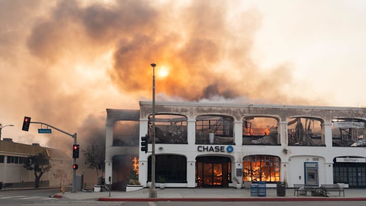 A Chase bank on Sunset Blvd. in the Pacific Palisades neighborhood burns on Jan. 8, 2025, after a wildfire broke out in Los Angeles County on Jan. 7. The fires destroyed more than 1,000 homes, businesses and other structures, Los Angeles County Fire Chief Anthony Marrone said at a briefing Wednesday. A Chase bank on Sunset Blvd. in the Pacific Palisades neighborhood burns on Jan. 8, 2025, after a wildfire broke out in Los Angeles County on Jan. 7. The fires destroyed more than 1,000 homes, businesses and other structures, Los Angeles County Fire Chief Anthony Marrone said at a briefing Wednesday.