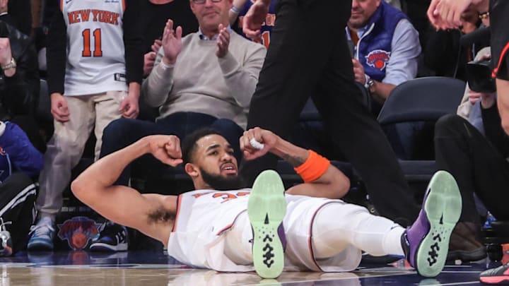 Feb 12, 2025; New York, New York, USA;  New York Knicks center Karl-Anthony Towns (32) reacts after getting fouled on a made basket in the third quarter against the Atlanta Hawks at Madison Square Garden. Mandatory Credit: Wendell Cruz-Imagn Images