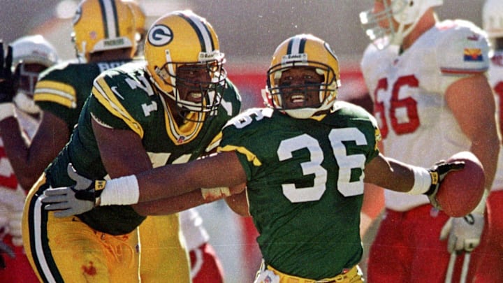 Green Bay Packers safety LeRoy Butler (36) celebrates an interception with help from teammate Santana Dotson (71) during the fourth quarter of their game Sunday, Sept. 24, 2000 at Sun Devil Stadium in Tempe, Ariz.

Leroy Butler 36 Packers Vs Cardinals