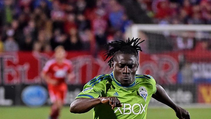 Nov 8, 2015; Dallas, TX, USA;  Seattle Sounders FC forward Obafemi Martins (9) dribbles the ball against FC Dallas during the second half in the MLS Playoffs at Toyota Stadium. Mandatory Credit: Jasen Vinlove-Imagn Images