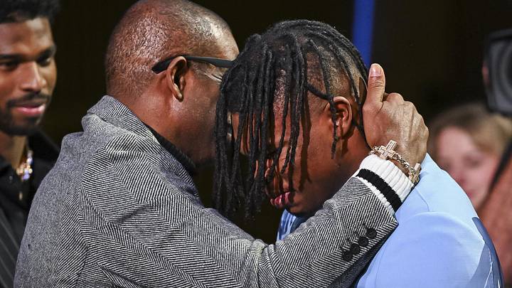 Dec 14, 2024; New York, NY, USA; Colorado Buffaloes wide receiver/cornerback Travis Hunter with head coach Deion Sanders after winning the 2024 Heisman Trophy. Mandatory Credit: Todd Van Emst/Heisman Trust via Imagn Images Dec 14, 2024; New York, NY, USA; Colorado Buffaloes wide receiver/cornerback Travis Hunter with head coach Deion Sanders after winning the 2024 Heisman Trophy. Mandatory Credit: Todd Van Emst/Heisman Trust via Imagn Images
