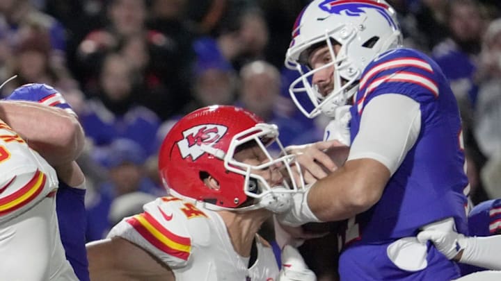 Buffalo Bills quarterback Josh Allen is able to get then ball over the end zone line for a touchdown despite Kansas City Chiefs linebacker Leo Chenal trying to push I’m back during first half action against the Kansas City Chiefs at Highmark Stadium in Orchard Park on Nov. 2, 2025. It took the officials a long minute to call it a touchdown.