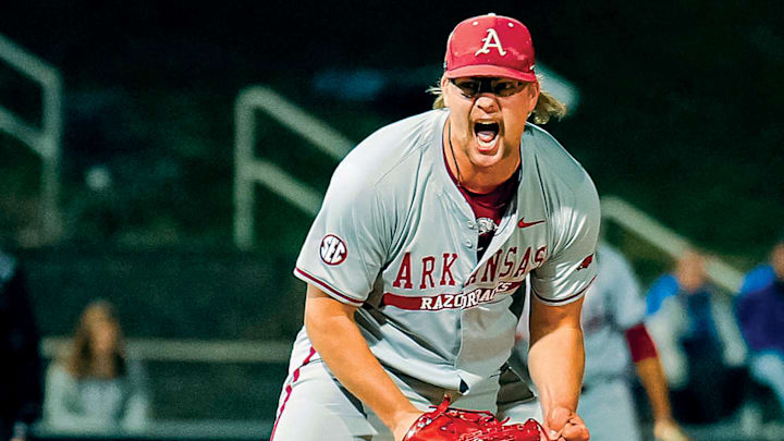 Arkansas pitcher Ethan McElvain celebrates the last out needed to hold onto a 5-4 win over Kentucky in Lexington to tie the series 1-1.