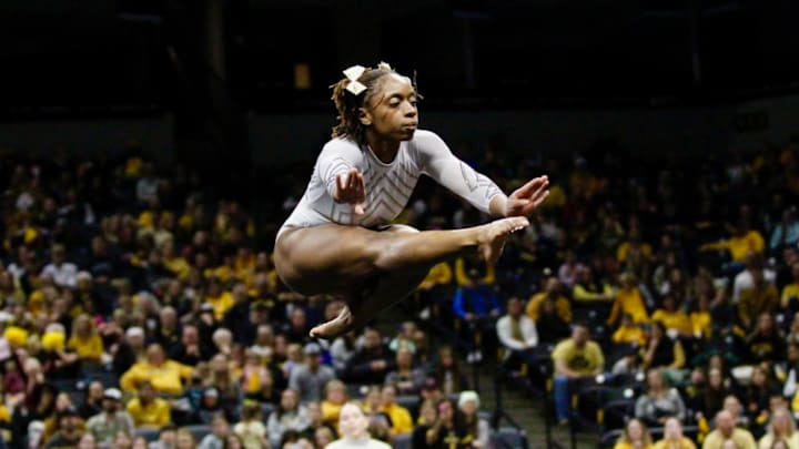 Friday, Jan. 16, 2026; Hannah Horton leaps in the air during her floor routine. Horton scored a 9.925 for a tie for the floor crown. Friday, Jan. 16, 2026; Hannah Horton leaps in the air during her floor routine. Horton scored a 9.925 for a tie for the floor crown.
