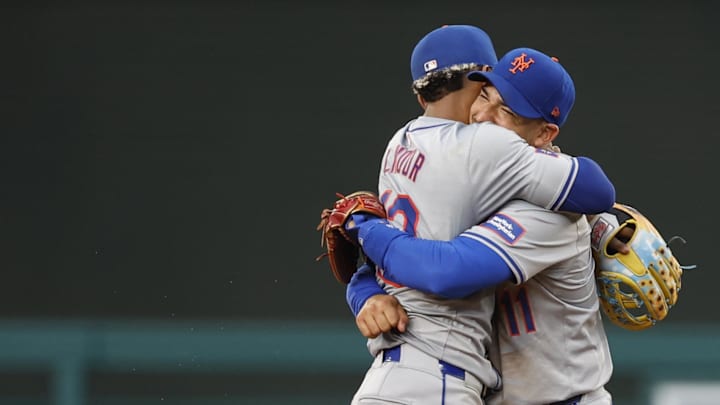 Jun 5, 2024; Washington, District of Columbia, USA; New York Mets shortstop Francisco Lindor (12) celebrates with Mets shortstop Jose Iglesias (11) after the final out against the Washington Nationals at Nationals Park. Mandatory Credit: Geoff Burke-Imagn Images