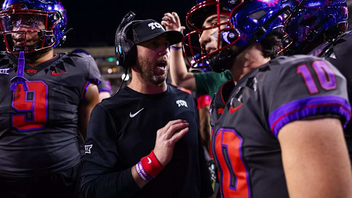 TCU offensive coordinator and associate head coach Kendal Briles talks to quarterback Josh Hoover (10) before the Frogs take the field for an offensive series.