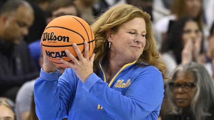 Nov 24, 2024; Los Angeles, California, USA; UCLA Bruins head coach Cori Close hands the basketball to a referee during the second quarter against the South Carolina Gamecocks at Pauley Pavilion presented by Wescom. Mandatory Credit: Robert Hanashiro-Imagn Images