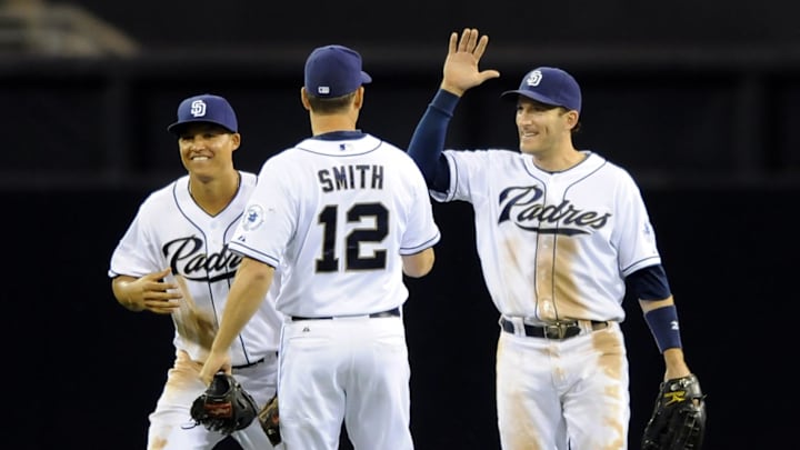 Apr 18, 2014; San Diego, CA, USA; San Diego Padres right fielder Chris Denorfia (R) celebrates with center fielder Will Venable (L) and left fielder Seth Smith (12) after defeating the San Francisco Giants 2-1 at Petco Park. Mandatory Credit: Christopher Hanewinckel-Imagn Images