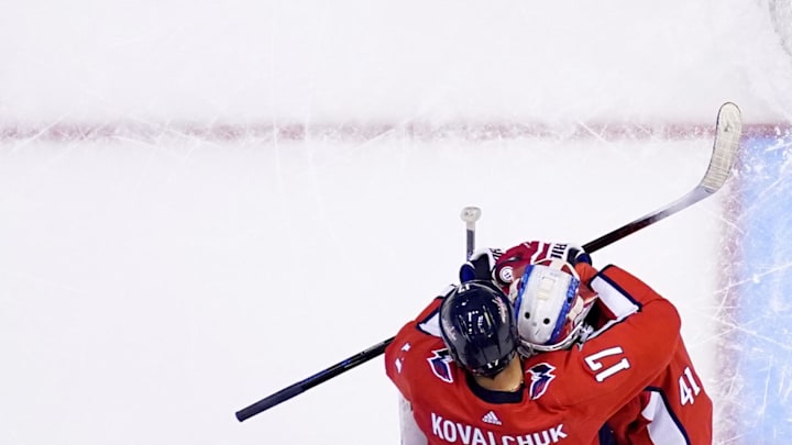 July 29, 2020; Toronto, Ontario, CANADA; Goaltender Vitek Vanecek #41 of the Washington Capitals is congratulated by teammates Ilya Kovalchuk #17, Lars Eller #20 and Nicklas Backstrom #19 after getting the save to win 3-2 in the exhibition game over the Carolina Hurricanes prior to the 2020 NHL Stanley Cup Playoffs at Scotiabank Arena on July 29, 2020 in Toronto, Ontario.  Mandatory Credit: Mark Blinch/NHLI via Imagn Images