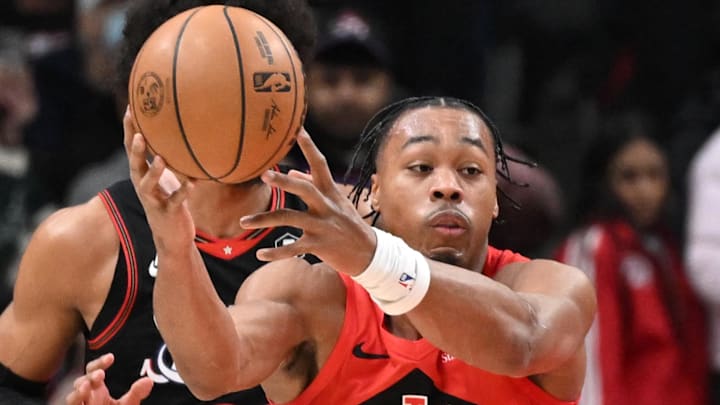 Toronto Raptors forward Scottie Barnes reaches for the ball against the Philadelphia 76ers.