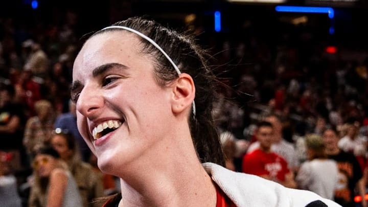 Indiana Fever guard Caitlin Clark (22) smiles in an interview after becoming the first rookie to achieve a triple-double Saturday, July 6, 2024, during the game at Gainbridge Fieldhouse in Indianapolis. The Fever defeated the Liberty, 83-78.