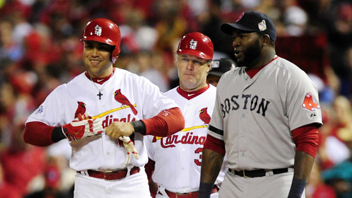 Oct 28, 2013; St. Louis, MO, USA; St. Louis Cardinals right fielder Carlos Beltran (3) talks with Boston Red Sox first baseman David Ortiz (right) after hitting a single during the second inning of game five of the MLB baseball World Series at Busch Stadium. Mandatory Credit: Jeff Curry-Imagn Images