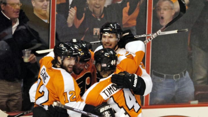 May 12, 2010; Philadelphia, PA USA;  Philadelphia Flyers players Simon Gagne (12) and Kimmo Timonen (44) and Braydon Coburn (5) celebrate goal scored by Mike Richards (18) during the 1st period of game six of the Eastern Conference semifinals against the Boston Bruins at the Wachovia Center in Philadelphia.