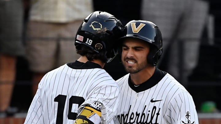 Vanderbilt’s Mike Mancini, right, bump helmets with Rustan Rigdon (19) after hitting a home run during the eighth inning of the Nashville Regional NCAA Baseball Tournament game against Wright State at Hawkins Field Friday, May 30, 2025, in Nashville, Tenn. Vanderbilt’s Mike Mancini, right, bump helmets with Rustan Rigdon (19) after hitting a home run during the eighth inning of the Nashville Regional NCAA Baseball Tournament game against Wright State at Hawkins Field Friday, May 30, 2025, in Nashville, Tenn.
