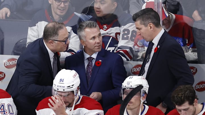 Nov 3, 2022; Winnipeg, Manitoba, CAN;  Montreal Canadiens Assistant Coach Stephane Robidas, Montreal Canadiens Head Coach Martin St. Louis and Montreal Canadiens Assistant Coach Alex Burrows discuss a play before overtime against the Winnipeg Jets at Canada Life Centre. Mandatory Credit: James Carey Lauder-Imagn Images