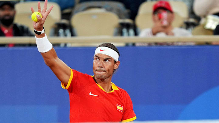 Jul 28, 2024; Paris, France; Rafael Nadal (ESP) waves to crowd before paying against Maximo Gonzales (ARG) and Andres Molteni  (ARG) in the men's tennis doubles first round during the Paris 2024 Olympic Summer Games at Stade Roland Garros.