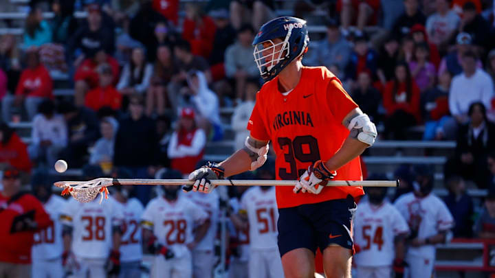 Cole Kastner collects a ground ball during the Virginia men's lacrosse game against Maryland at SECU Stadium. Cole Kastner collects a ground ball during the Virginia men's lacrosse game against Maryland at SECU Stadium.