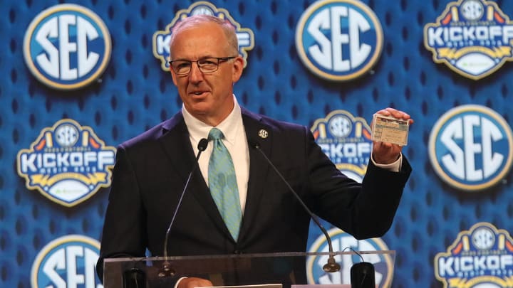 SEC Commissioner Greg Sankey shows his ticket to Nolan Ryan's 7th no-hitter during SEC Media Days.