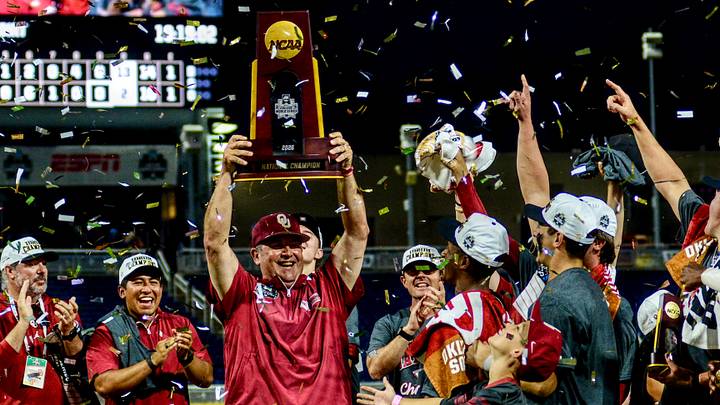 Oklahoma coach Skip Johnson raises the NCAA Championship Trophy after the Sooners won the College World Series. Oklahoma coach Skip Johnson raises the NCAA Championship Trophy after the Sooners won the College World Series.