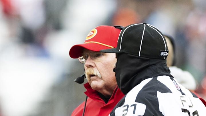 Dec 15, 2024; Cleveland, Ohio, USA; Kansas City Chiefs head coach Andy Reid challenges  a play call with field judge Mearl Robinson (31) during the third quarter against the Cleveland Browns at Huntington Bank Field. Mandatory Credit: Scott Galvin-Imagn Images