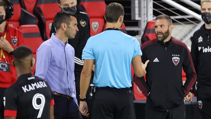Oct 3, 2020; Washington, DC, Washington, DC, USA; Referee Joseph Dickerson (M) talks with Atlanta