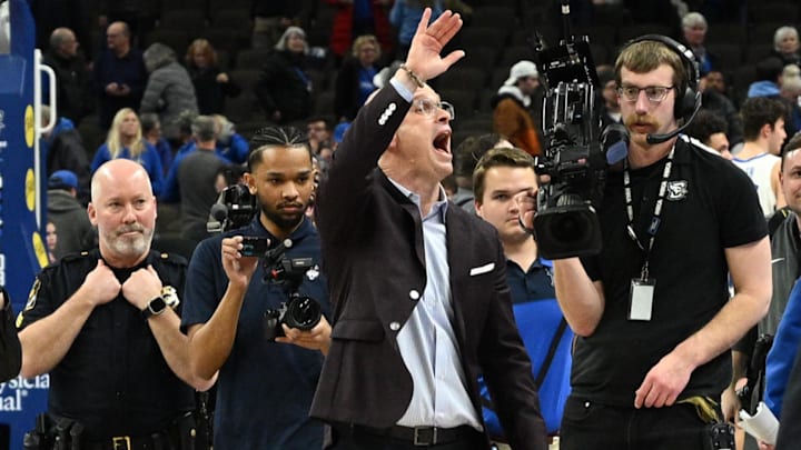 Feb 11, 2025; Omaha, Nebraska, USA;  Connecticut Huskies head coach Dan Hurley waves to the crowd after the win against the Creighton Bluejays at CHI Health Center Omaha.