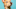 Portrait of a tan dog against teal backdrop. Portrait of a tan dog against teal backdrop.