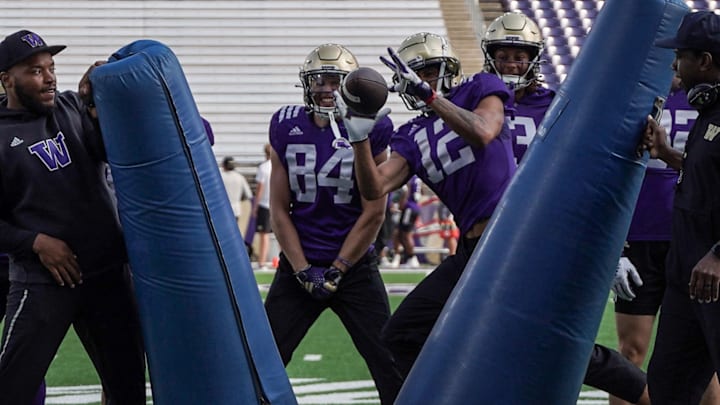 Denzel Boston practices catching a ball in a tight window. Denzel Boston practices catching a ball in a tight window.