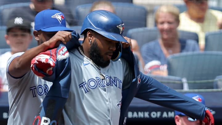 Toronto Blue Jays first baseman Vladimir Guerrero Jr. (27) celebrates his solo home run against the New York Yankees with third baseman Luis De Los Santos (20) during the first inning at Yankee Stadium in 2024.