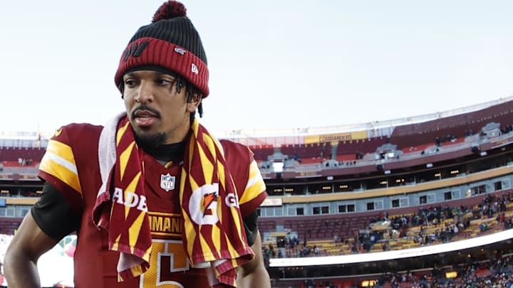 Washington Commanders quarterback Jayden Daniels (5) stands on the field after the Commanders' game against the Philadelphia Eagles at Northwest Stadium. 